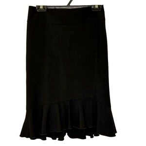 Black skirt with flounce bottom. Back zipper. Worn once.